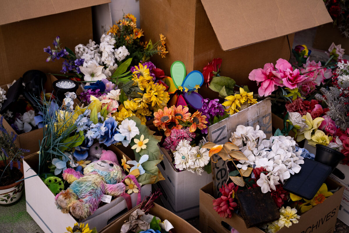 Flowers from the George Floyd Memorial in boxes as the city moves in to open up the streets.