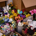 Flowers from the George Floyd Memorial in boxes as the city moves in to open up the streets.