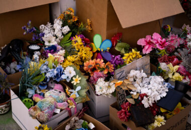 Flowers from the George Floyd Memorial in boxes as the city moves in to open up the streets.