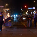 Garbage cans burn at Hennepin Avenue and Lake Street in Uptown Minneapolis during protests over the June 3rd law enforcement shooting death of Winston Smith.