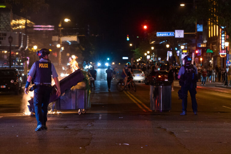Minneapolis police and burning dumpsters during protests 4 Garbage cans burn at Hennepin Avenue and Lake Street in Uptown Minneapolis during protests over the June 3rd law enforcement shooting death of Winston Smith.