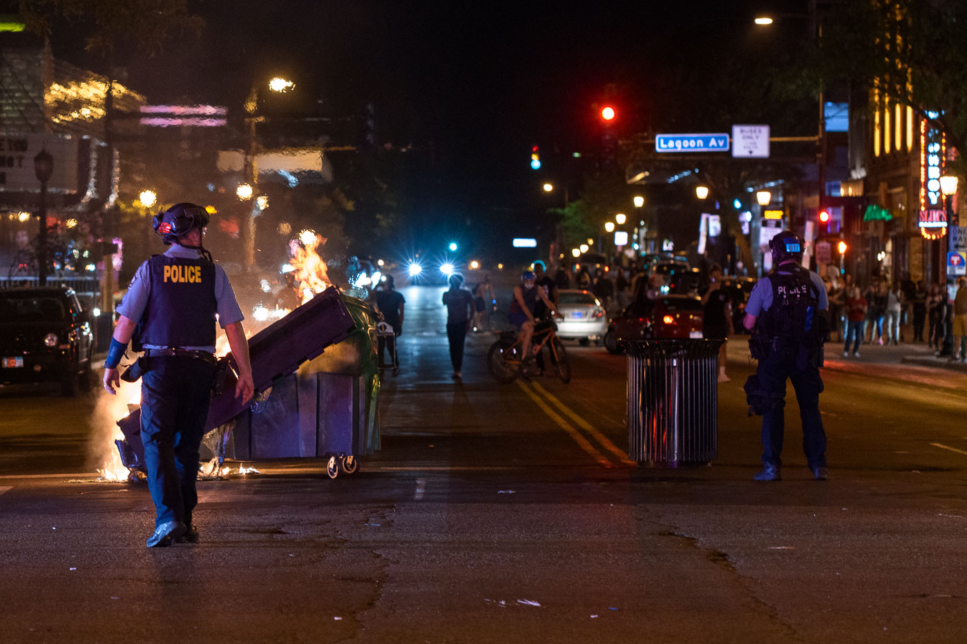 Minneapolis police and burning dumpsters during protests