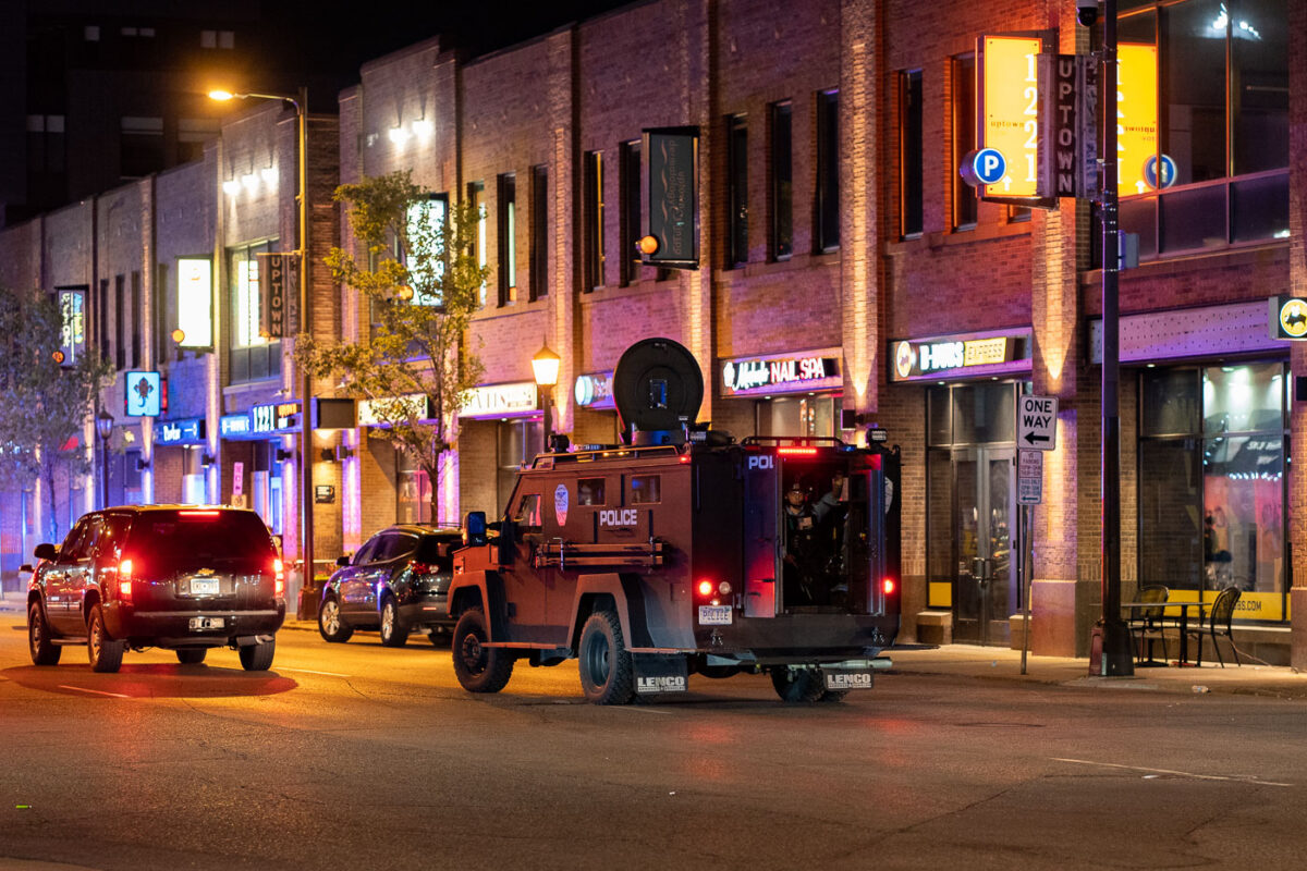 Minneapolis police in the back of a bearcat vehicle driving down Lake Street in Uptown Minneapolis during protests over the shooting death of Winston Smith on June 3rd.