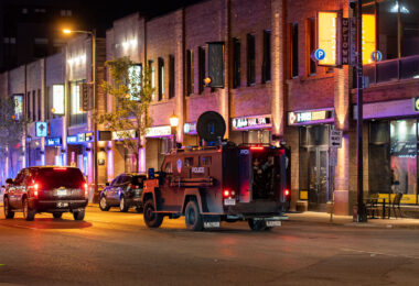 Minneapolis police in the back of a bearcat vehicle driving down Lake Street in Uptown Minneapolis during protests over the shooting death of Winston Smith on June 3rd.
