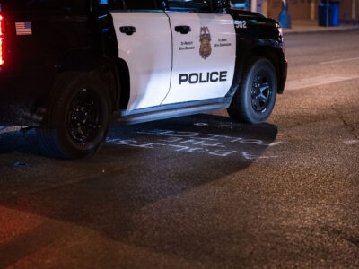 Minneapolis Police Car Over "Abolish The Police" Graffiti on Lake Street