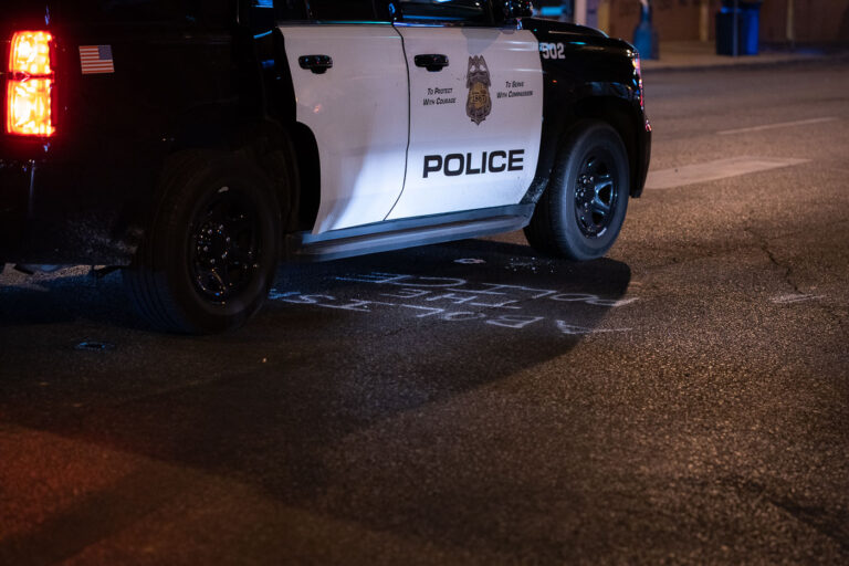 Minneapolis police drives over Abolish The Police graffiti 1 A Minneapolis Police squad car drives over "Abolish The Police" graffiti on Lake Street in Uptown Minneapolis.