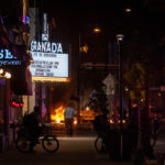 Minneapolis Police on Hennepin Avenue while fires burn in the streets following the June 3rd shooting death of Winston Smith by Federal law enforcement.