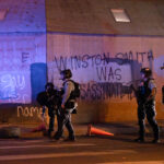 Minneapolis police on Hennepin Ave and Lake Street near where protesters have been holding space after the June 3rd and June 13th killings of Winston Smith and Deona Marie.Deona Marie was killed when Nicholas Kraus drove his vehicle into those protesting the killing of Winston Smith.Winston Smith was killed after Hennepin and Ramsey County officers fired their weapons while part of a Federal Task Force serving a warrant.