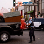 Minneapolis police load up a pickup with materials being used by protesters for barricades. Protesters have been holding space following the June 3rd and June 13th deaths of Winston Smith and Deona Marie.Winston Smith was killed after Hennepin and Ramsey County officers fired their weapons while part of a Federal Task Force serving a warrant. Deona Marie was killed when Nicholas Kraus drove his vehicle into those protesting the killing of Smith.