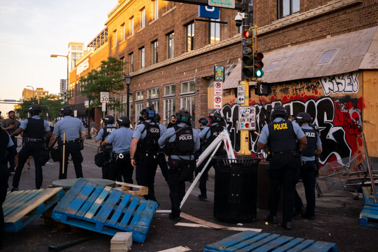 Minneapolis police respond to clear barricades 1 Minneapolis Police move in to dismantle protest barricades and move out protesters who had been gathered protesting the June 3rd killing of Winston Smith and June 13th killing of Deona Marie.
Winston Smith was killed after Hennepin and Ramsey County officers fired their weapons while part of a Federal Task Force serving a warrant.
Deona Marie was killed when Nicholas Kraus drove his vehicle into those protesting the killing of Smith.