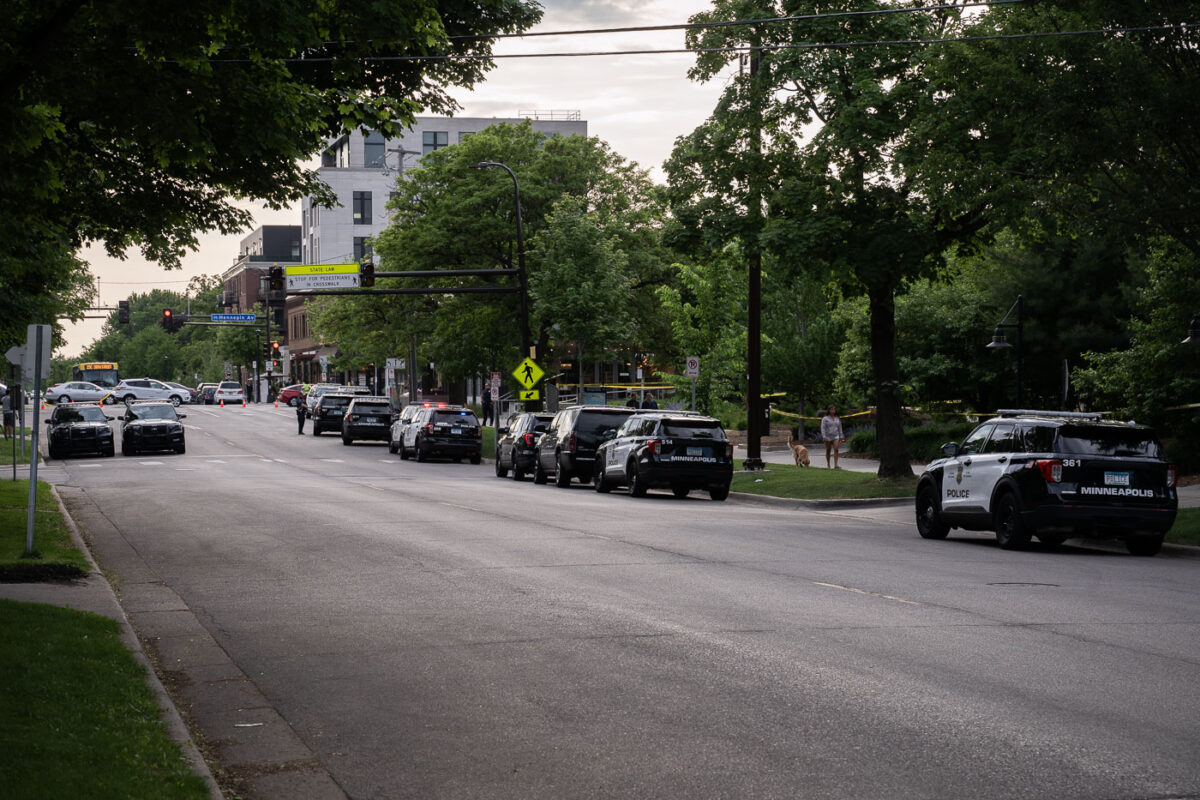 Minneapolis police squad cars line the streets around the parking ramp that Winston Smith was shot and killed on top of hours earlier.