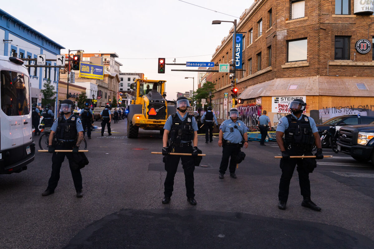 Minneapolis Police officers in a line at Hennepin Avenue and Lake Street in Uptown Minneapolis. This follow days of protests following the June 3rd killing of Winston Smith and June 13th killing of Deona Marie.

Winston Smith was killed after Hennepin and Ramsey County officers fired their weapons while part of a Federal Task Force serving a warrant. 

Deona Marie was killed when Nicholas Kraus drove his vehicle into those protesting the killing of Smith.