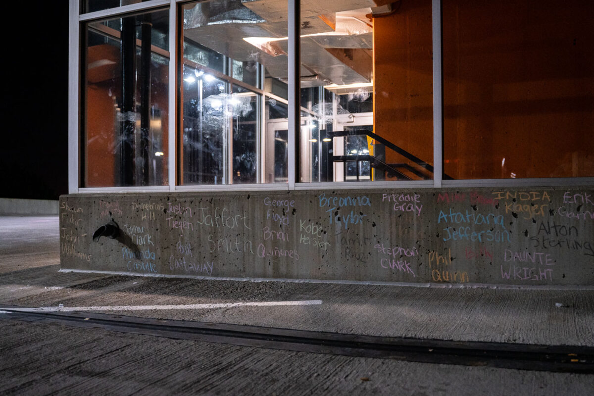 The names of others effected by police violence written on the top of the parking ramp where Winston Smith was killed by law enforcement days earlier.