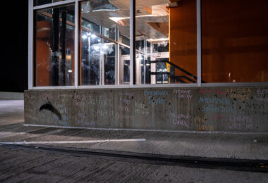 The names of others effected by police violence written on the top of the parking ramp where Winston Smith was killed by law enforcement days earlier.