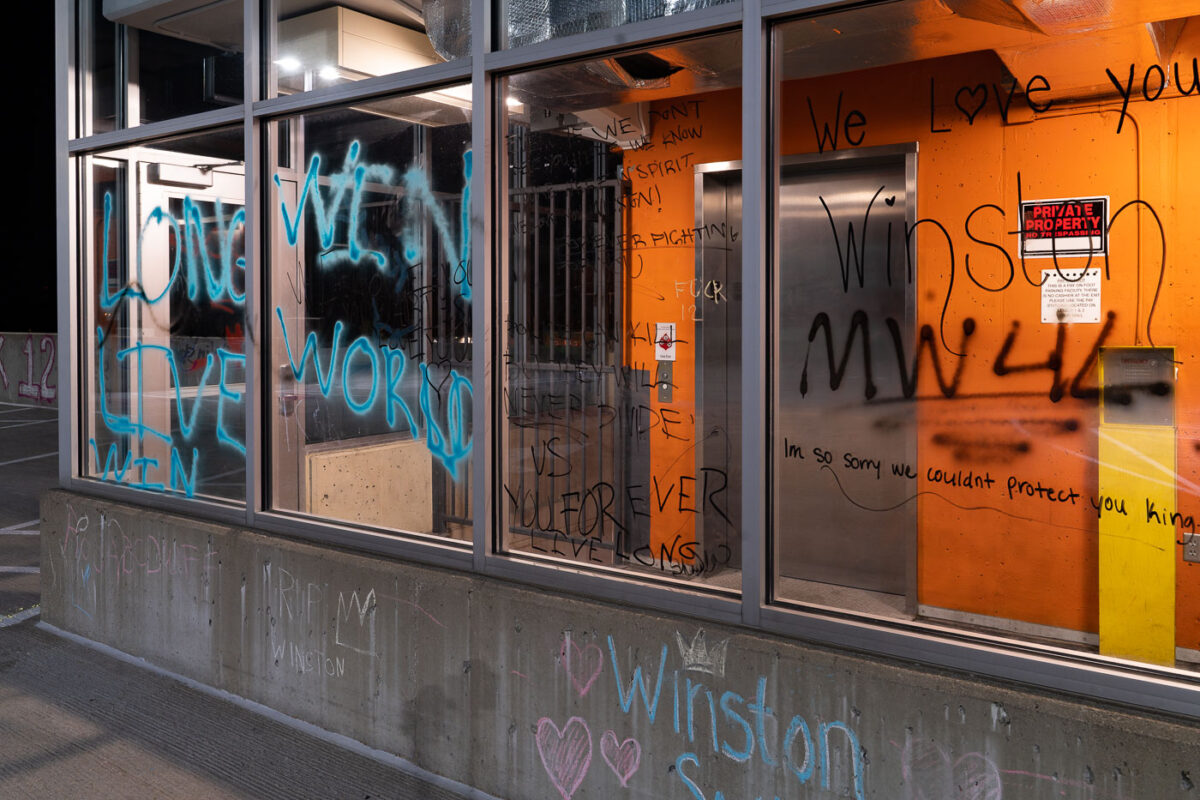 Graffiti on windows on the top floor of the Seven Points parking ramp where Winston Smith was shot and killed by a Federal Task Force on June 3rd.