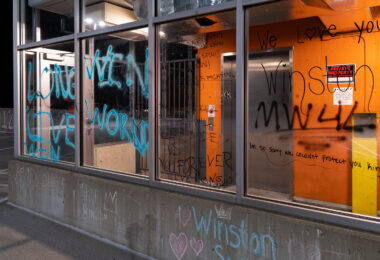 Graffiti on windows on the top floor of the Seven Points parking ramp where Winston Smith was shot and killed by a Federal Task Force on June 3rd.