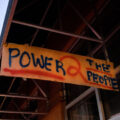 A sign reading "Power 2 the people" hanging from Seven Points mall. Winston Smith was killed earlier in the month by a Federal Task Force.