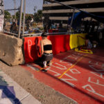 Protesters paint the concrete barriers around a peace garden built by those protesting the June 3rd and June 13th deaths of Winston Smith and Deona Marie.Deona Marie was killed when Nicholas Kraus drove his vehicle into those protesting the killing of Winston Smith.Winston Smith was killed after Hennepin and Ramsey County officers fired their weapons while part of a Federal Task Force serving a warrant.