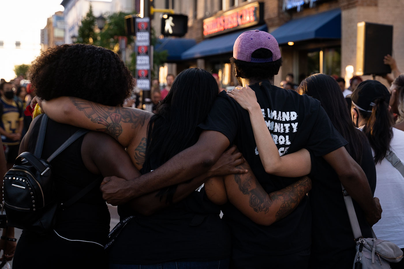 Protesters embrace at Winston Smith protest