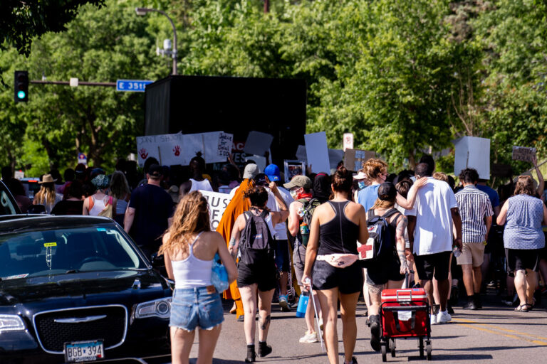 Protesters marching on Cedar Ave in Minneapolis 2 Protesters march from the Holiday Gas station at 36th Street and Cedar Ave where Dolal Idd was killed by Minneapolis Police on December 30th.