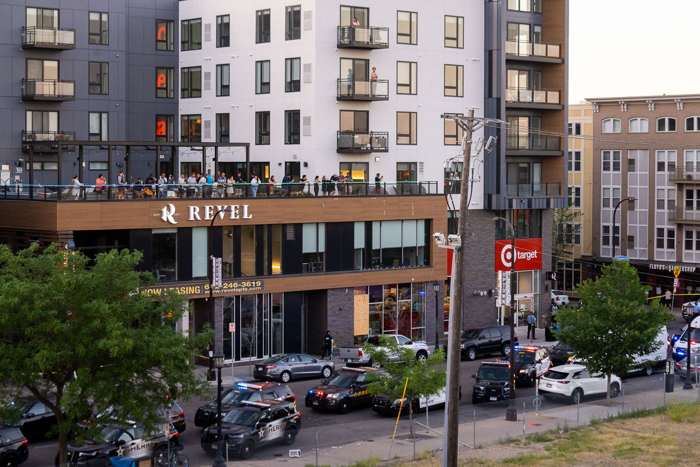 Renters look down at law enforcement clearing protest site