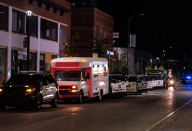Minneapolis police park on Hennepin Avenue in Uptown Minneapolis. Police have been responding to protesters who have been gathered in the area following the law enforcement shooting death of Winston Smith.