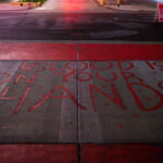 "The Blood Is On Your Hands" written on a private drive outside the parking ramp that Winston Smith was killed by law enforcement on June 3rd, 2021.