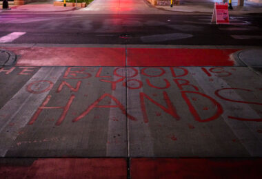 "The Blood Is On Your Hands" written on a private drive outside the parking ramp that Winston Smith was killed by law enforcement on June 3rd, 2021.