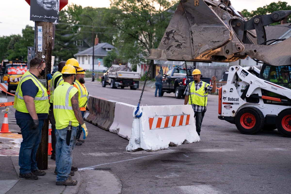 City employees move in to open George Floyd Square to vehicle traffic.