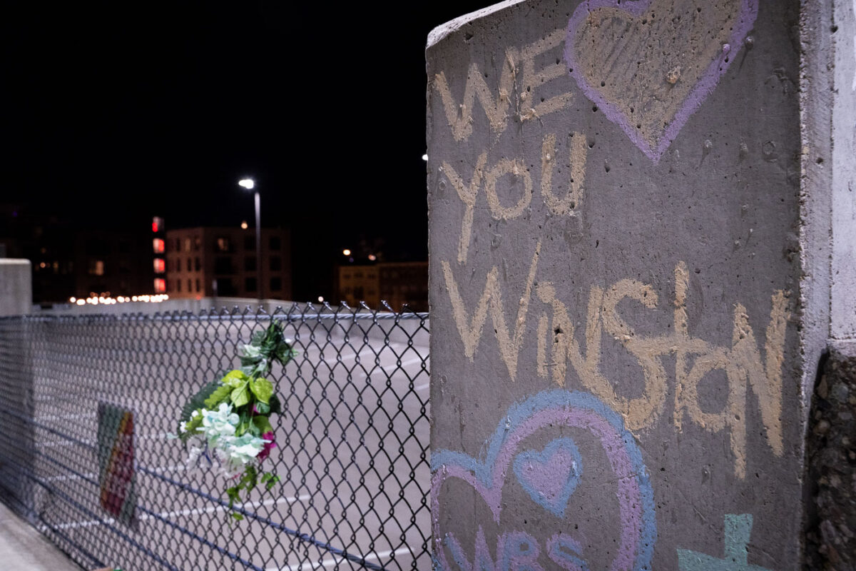 "We love you Winston" written on a pillar next to where Winston Smith was shot and killed by law enforcement on June 3rd, 2021.