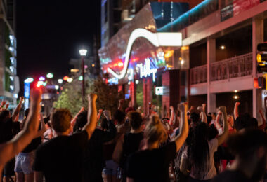Protesters hold their firsts up during a march in Uptown Minneapolis on the third day of protests following the law enforcement shooting death of Winston Smith on June 3rd.