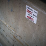Anti-Landlord Sticker on Downtown Wall — Minneapolis 1 A handwritten sticker criticizing property ownership dynamics is affixed to a concrete wall in downtown Minneapolis. Reading “Landlords don’t ‘provide’ housing, they hold it ransom,” the message reflects growing public frustration with rising rents and the commodification of housing. Such small-scale urban protest art has become a recurring visual language across Minneapolis since the 2020s, echoing broader debates about housing justice and economic inequality.