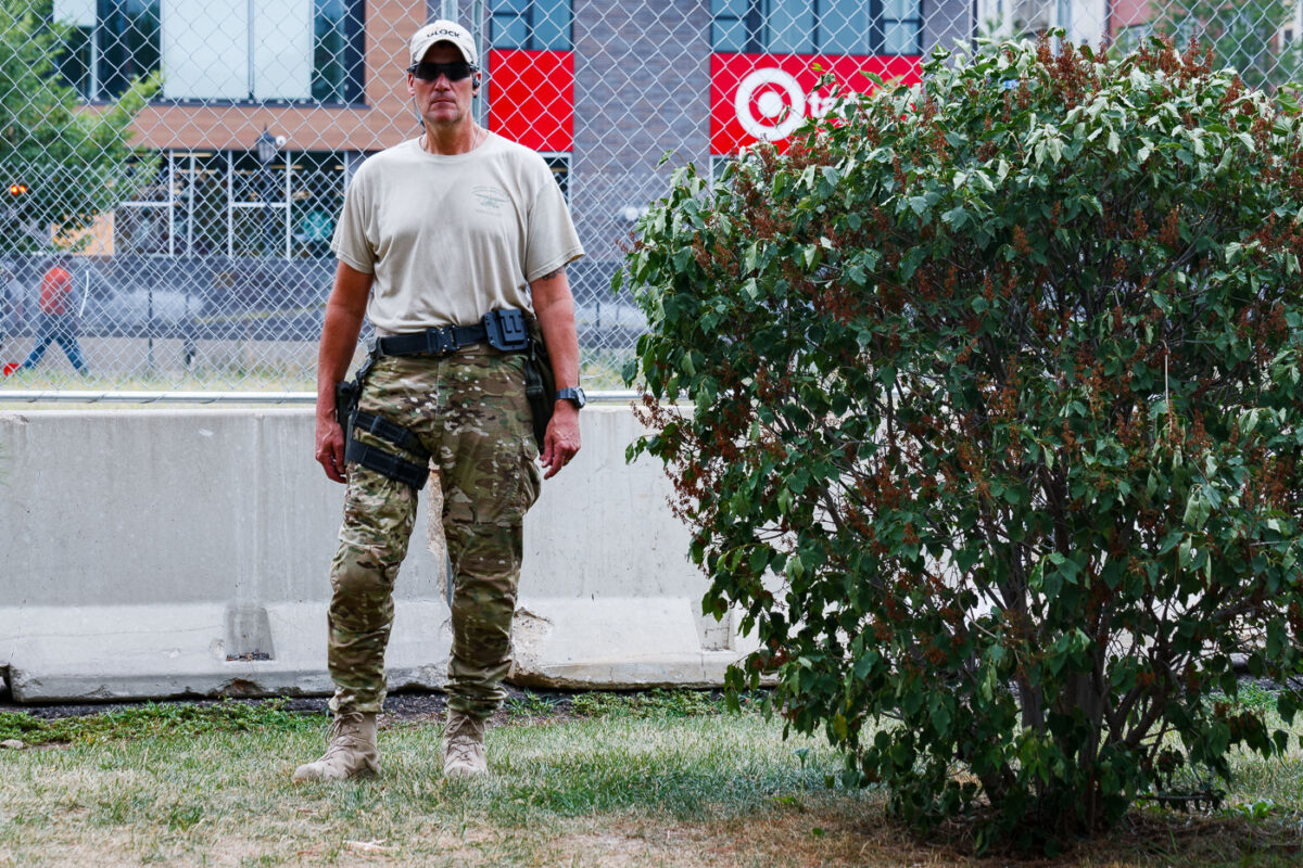 Private security clears out the Winston Smith and Deona Marie memorial in Uptown Minneapolis. Some of the contractors were carrying restraint zip ties while being armed with military fatigue. The space had been a protest zone after law enforcement killed Winston Smith on June 3rd. Deona Marie was killed 10 days later when a man drove through barricades into the protesters.