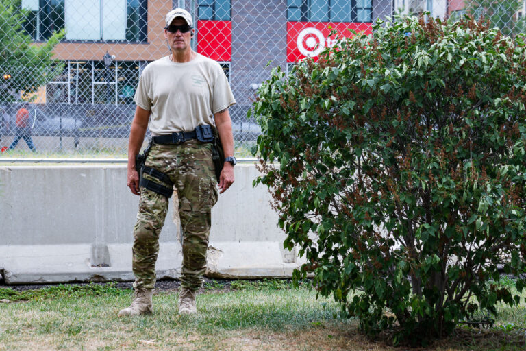 Armed private security at Seven Points protest 3 Private security clears out the Winston Smith and Deona Marie memorial in Uptown Minneapolis. Some of the contractors were carrying restraint zip ties while being armed with military fatigue. The space had been a protest zone after law enforcement killed Winston Smith on June 3rd. Deona Marie was killed 10 days later when a man drove through barricades into the protesters.