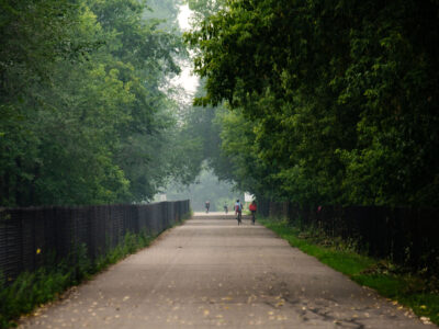 Midtown Greenway bikers with wildfire smoke