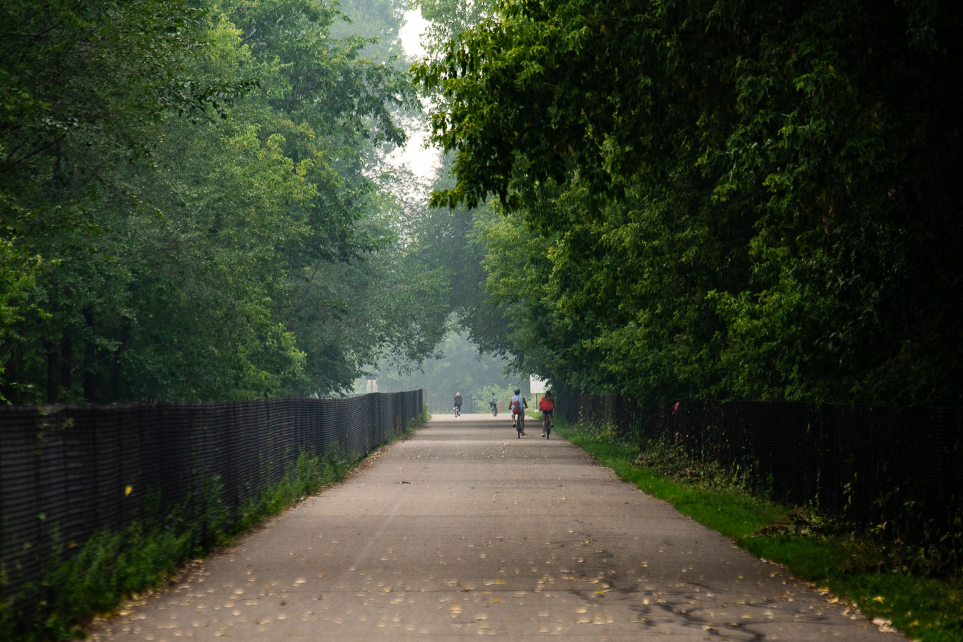 Bikers during wildfire smoke on Midtown greenway