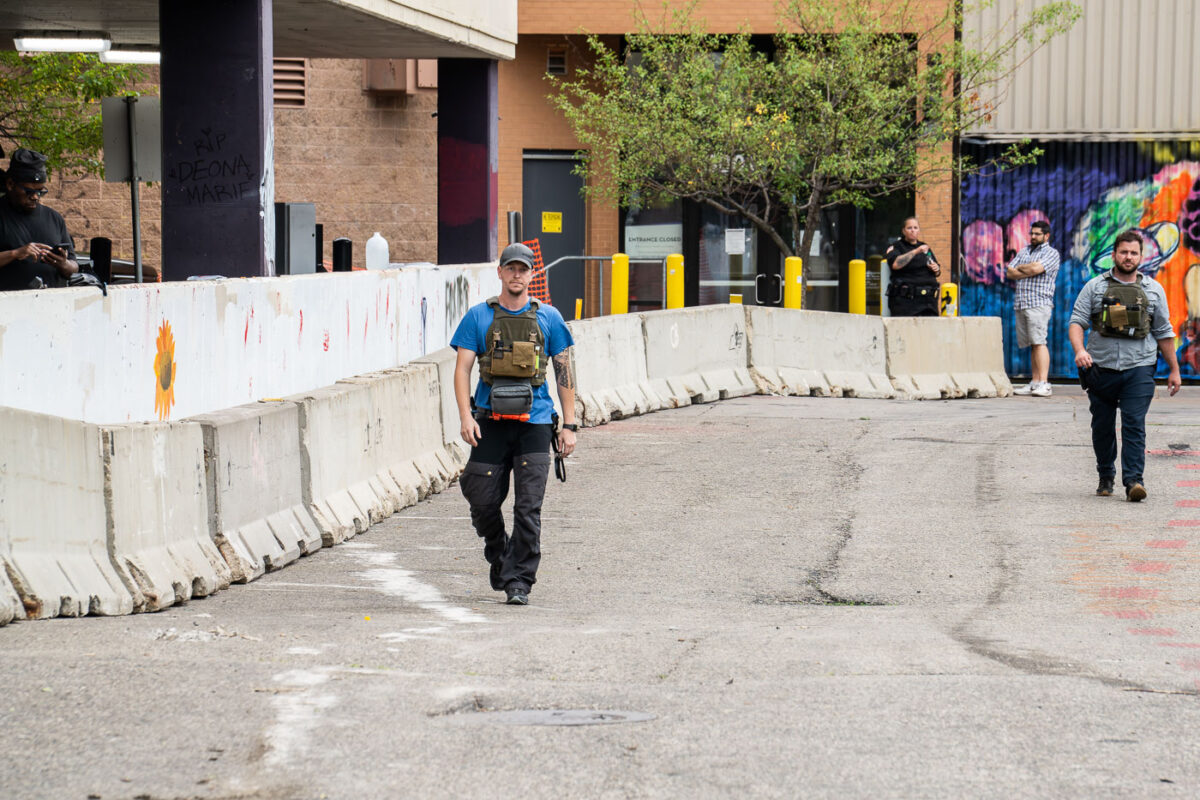 Private security clears out the Winston Smith and Deona Marie memorial in Uptown Minneapolis. Some of the contractors were carrying restraint zip ties while being armed with military fatigue. The space had been a protest zone after law enforcement killed Winston Smith on June 3rd. Deona Marie was killed 10 days later when a man drove through barricades into the protesters.