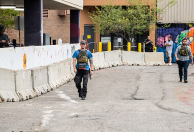 Private security clears out the Winston Smith and Deona Marie memorial in Uptown Minneapolis. Some of the contractors were carrying restraint zip ties while being armed with military fatigue. The space had been a protest zone after law enforcement killed Winston Smith on June 3rd. Deona Marie was killed 10 days later when a man drove through barricades into the protesters.