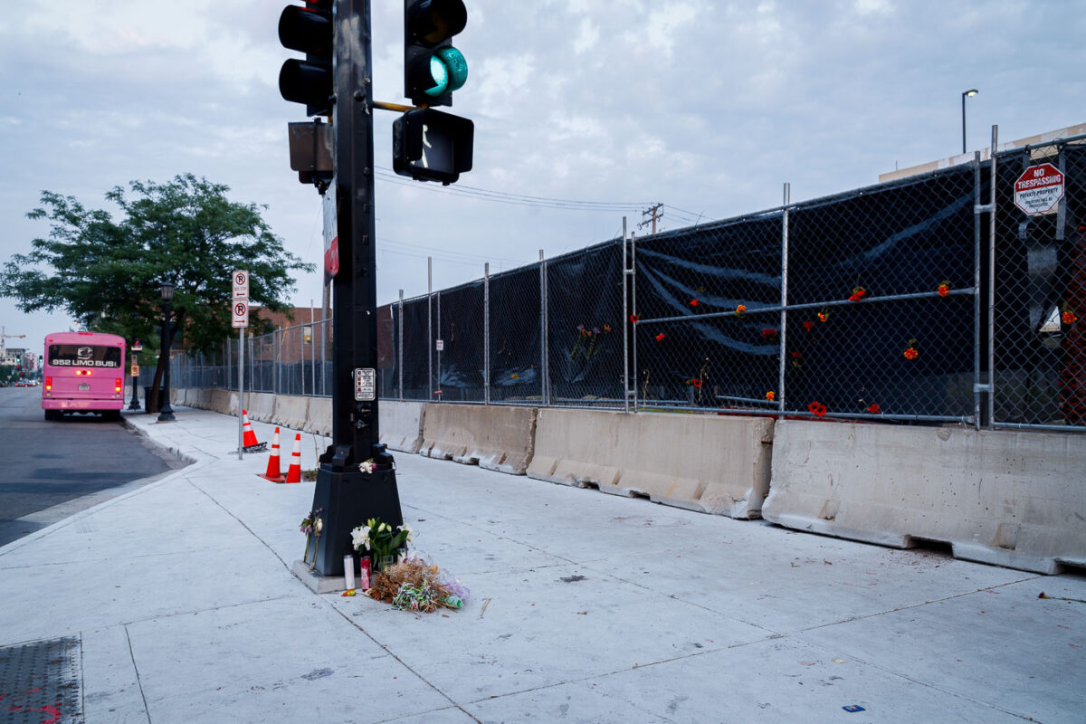 A few candles and flowers remain at the memorial for Deona Knajdek a week after the space was cleared by private security contractors. Knajdek was killed while protesting the law enforcement shooting death of Winston Smith 10 days prior when a car dove through barricades put in place by protesters.