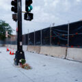 A few candles and flowers remain at the memorial for Deona Knajdek a week after the space was cleared by private security contractors. Knajdek was killed while protesting the law enforcement shooting death of Winston Smith 10 days prior when a car dove through barricades put in place by protesters.