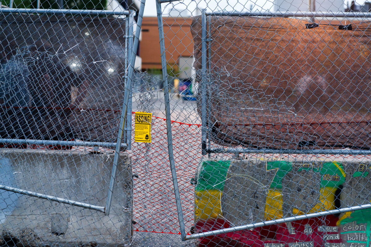 Security guards and fencing around the parking garage that held memorials for Winston smith and Deona Marie.