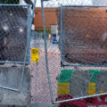 Security guards and fencing around the parking garage that held memorials for Winston smith and Deona Marie.