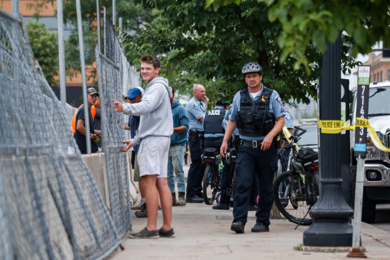 Fencing goes up at Winston Smith protest site 4 Minneapolis Police outside what was the Wince Marie Memorial Garden. Private security and police cleared the lot and fencing was put up.July 17, 2021