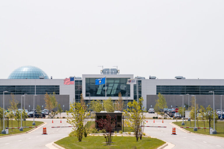 Foxconn Innovation Center and Globe, Mount Pleasant, Wisconsin 3 This photograph shows the main Foxconn Innovation Center in Mount Pleasant, Wisconsin, part of the company’s large but scaled-down industrial complex originally proposed as a high-tech manufacturing hub. The facility, operated under Foxconn Industrial Internet (Fii), houses research, development, and light manufacturing operations. In the background rises the company’s distinctive glass globe data center — a modern architectural landmark symbolizing Foxconn’s ambitions for advanced electronics and digital infrastructure in the Midwest.