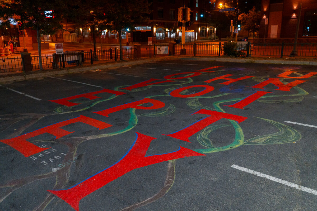 "Love Hope Unity" written in a parking lot on Franklin Avenue and Nicollet Avenue in Minneapolis.