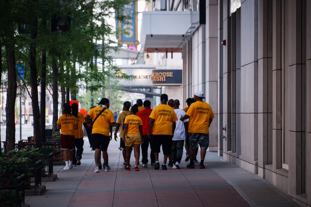 "Outreach Experts" walk the streets of Downtown Minneapolis.