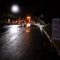 Signs at George Floyd Square on a rainy night in Minneapolis.