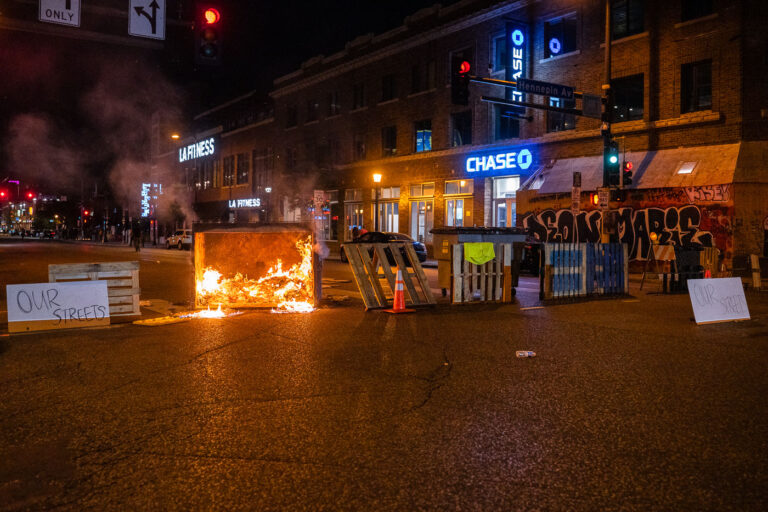 Our Streets barricades on Lake Street 1 Protesters close down the streets near the Winston Smith and Deona Marie memorials in Uptown Minneapolis. Winston Smith was killed by Hennepin and Ramsey County Sheriffs officers who were part of a Federal Task Force on June 3rd.
On June 10th, Deona Marie was killed when a protester drove his vehicle through barricades setup to protect those protesting the death of Winston Smith.