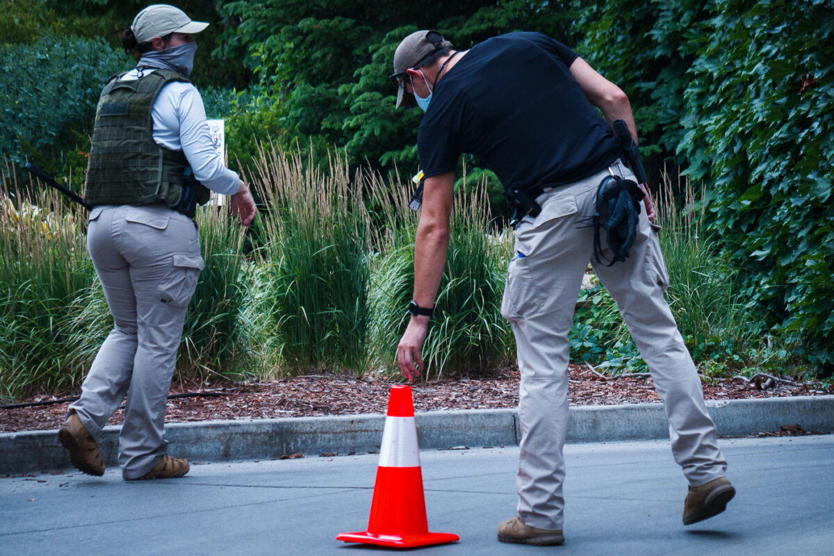 Private security clears out the Winston Smith and Deona Marie memorial in Uptown Minneapolis. Some of the contractors were carrying restraint zip ties while being armed with military fatigue. The space had been a protest zone after law enforcement killed Winston Smith on June 3rd. Deona Marie was killed 10 days later when a man drove through barricades into the protesters.