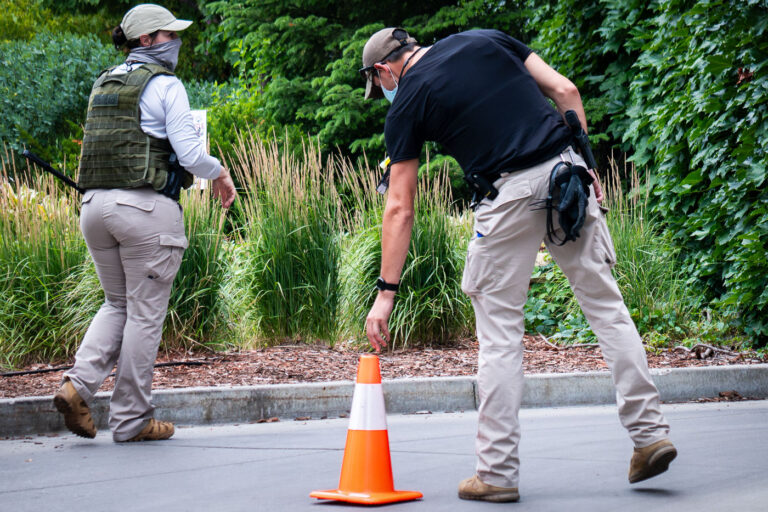 Private security at Seven Points 4 Armed security placing cones outside the Seven Points Mall parking garage.